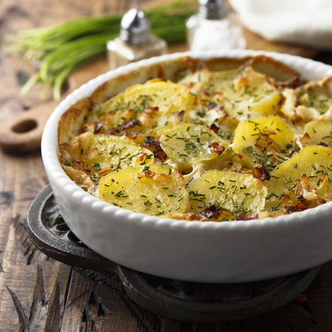 Potato gratin with bacon and herbs